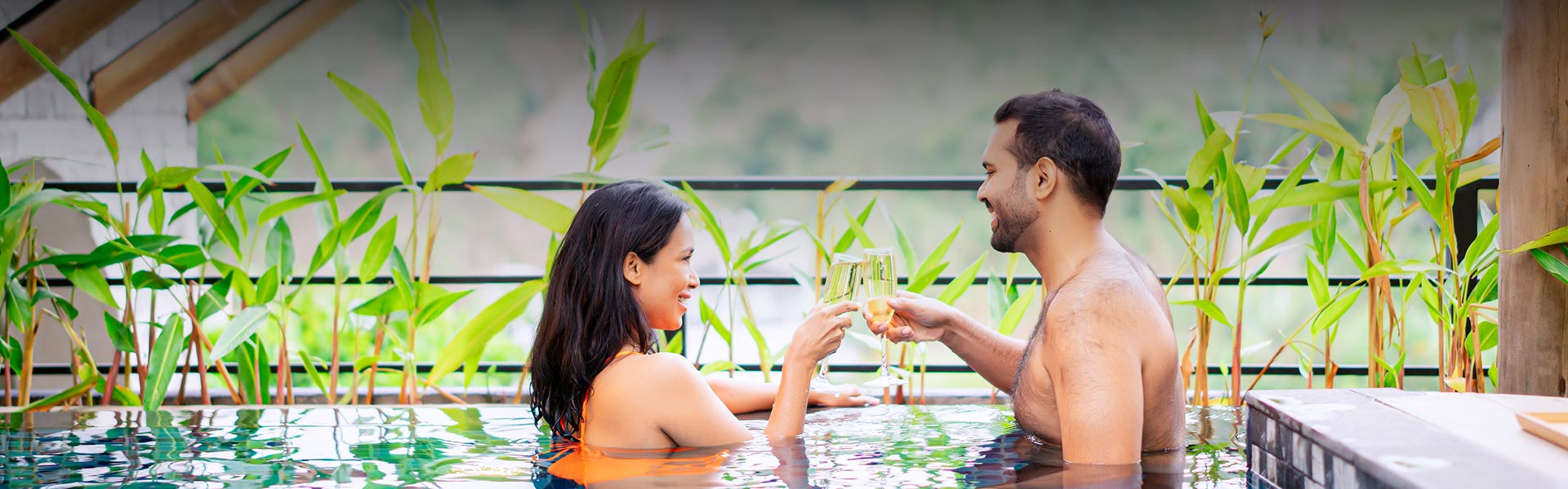 A couple is enjoying their time in the pool